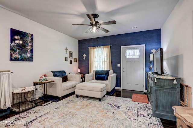 1831 Annie Baxter Ave, Joplin, MO 64804 - living room with dark wood-style floors, baseboards, a ceiling fan, and visible vents