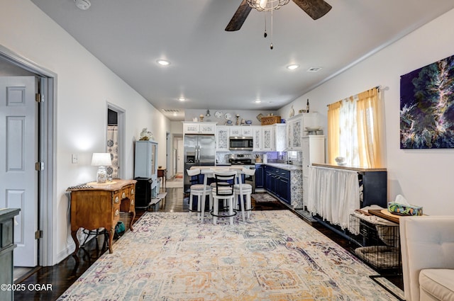 1831 Annie Baxter Ave, Joplin, MO 64804 - dining room with dark wood-type flooring, visible vents, ceiling fan, and recessed lighting