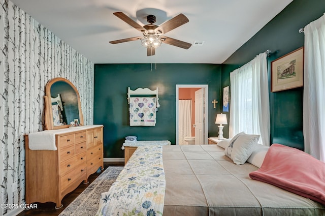 1831 Annie Baxter Ave, Joplin, MO 64804 - bedroom featuring visible vents, baseboards, an accent wall, ceiling fan, and wood finished floors