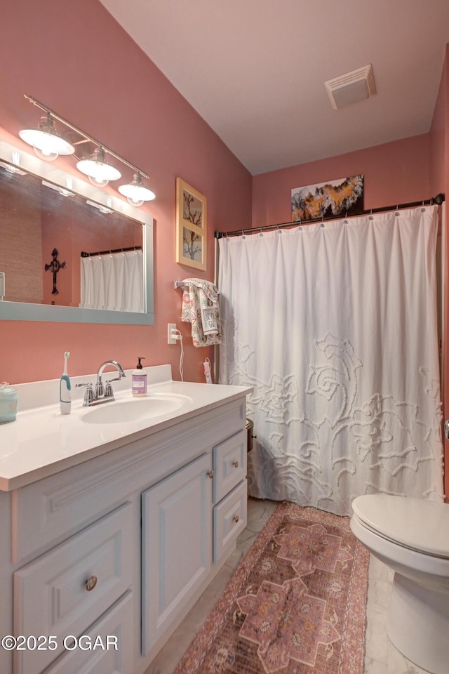 1831 Annie Baxter Ave, Joplin, MO 64804 - full bath featuring toilet, vanity, marble finish floor, and visible vents