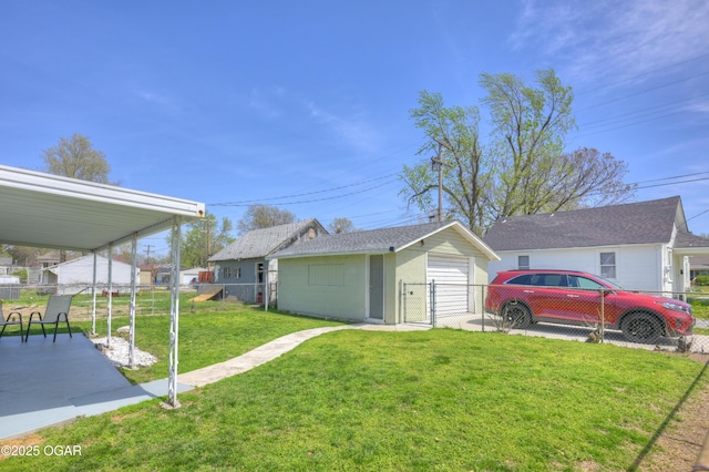 1831 Annie Baxter Ave, Joplin, MO 64804 - exterior space with a garage, an outdoor structure, fence, and a lawn