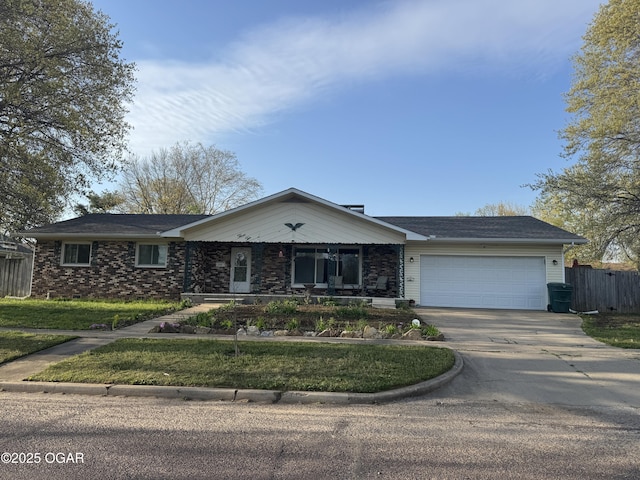 ranch-style house featuring a porch, fence, driveway, and a garage