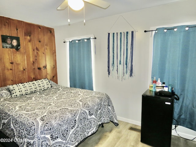 111A-B N Connor Ave, Joplin, MO 64801 - bedroom featuring visible vents, baseboards, a ceiling fan, and wood finished floors
