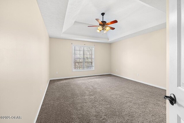 3826 W Randall St, Battlefield, MO 65619 - carpeted spare room with a tray ceiling, a textured ceiling, ceiling fan, and baseboards