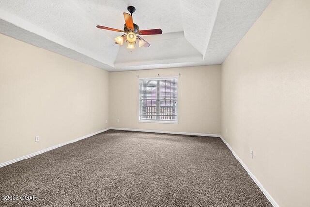 3826 W Randall St, Battlefield, MO 65619 - carpeted empty room featuring a tray ceiling, baseboards, a ceiling fan, and a textured ceiling