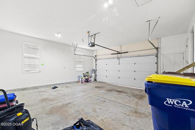 3826 W Randall St, Battlefield, MO 65619 - garage featuring a garage door opener