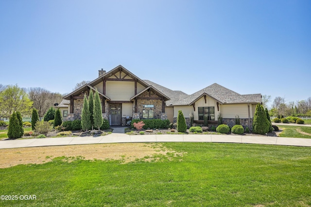1624 Liam St, Carthage, MO 64836 - craftsman-style house featuring a chimney, stone siding, and a front lawn