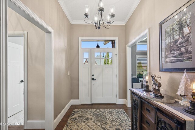 1624 Liam St, Carthage, MO 64836 - entrance foyer featuring a chandelier, dark wood-style floors, and crown molding