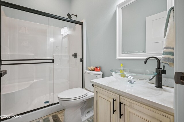 1624 Liam St, Carthage, MO 64836 - full bathroom featuring a shower stall, vanity, and toilet