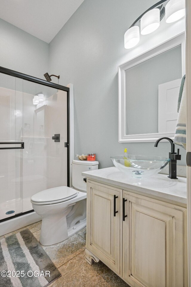 1624 Liam St, Carthage, MO 64836 - bathroom with toilet, vanity, and a shower stall