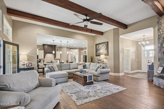 1624 Liam St, Carthage, MO 64836 - living area with ceiling fan with notable chandelier, recessed lighting, hardwood / wood-style floors, baseboards, and beam ceiling