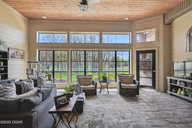 1624 Liam St, Carthage, MO 64836 - sunroom / solarium featuring wood walls, stone finish floor, a high ceiling, and wood ceiling