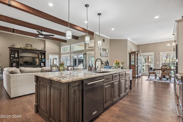 1624 Liam St, Carthage, MO 64836 - kitchen with ceiling fan, stainless steel dishwasher, dark brown cabinets, a sink, and a center island with sink