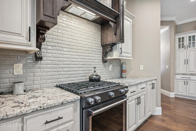 1624 Liam St, Carthage, MO 64836 - kitchen featuring range with gas cooktop, ornamental molding, decorative backsplash, and dark wood-style floors