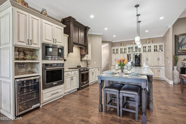 1624 Liam St, Carthage, MO 64836 - kitchen featuring ornamental molding, appliances with stainless steel finishes, light stone counters, wine cooler, and backsplash