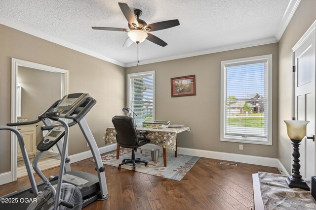 1624 Liam St, Carthage, MO 64836 - office area with baseboards, ceiling fan, a textured ceiling, crown molding, and dark wood-type flooring