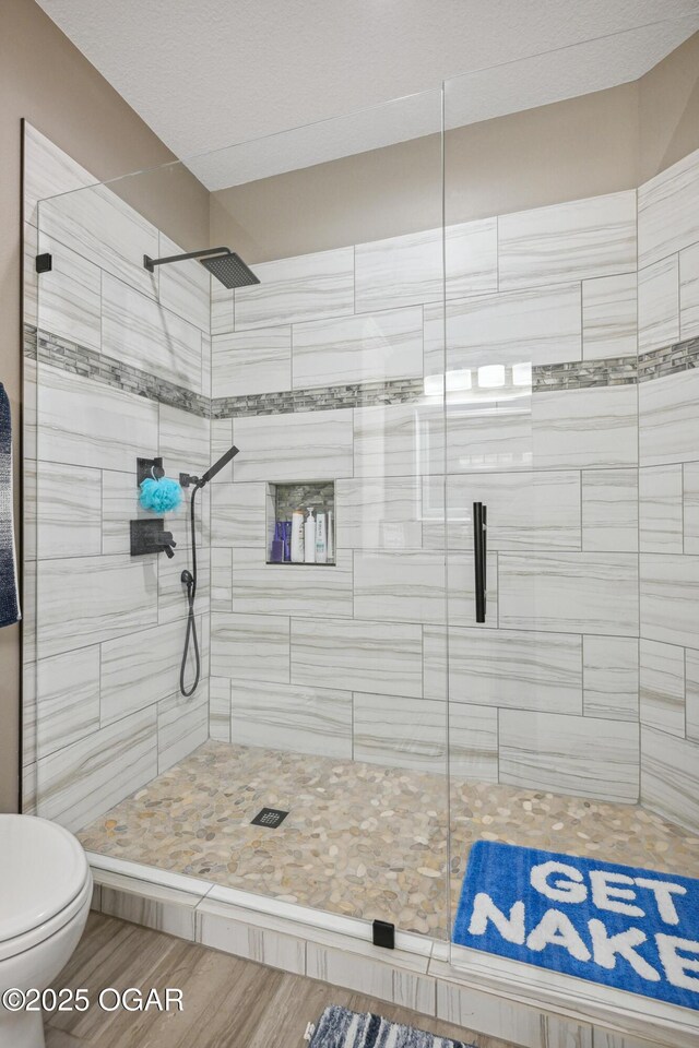 1624 Liam St, Carthage, MO 64836 - full bath featuring toilet, a shower stall, and wood finished floors