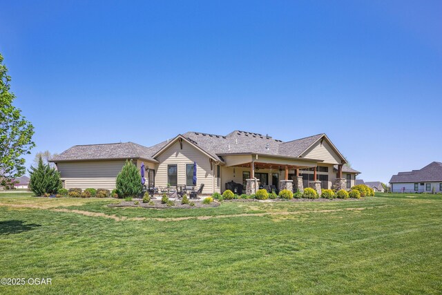 1624 Liam St, Carthage, MO 64836 - rear view of house with a yard and a patio area