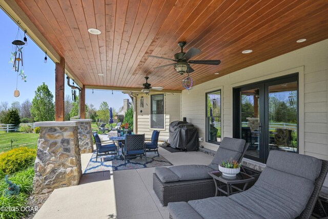 1624 Liam St, Carthage, MO 64836 - view of patio featuring area for grilling, outdoor dining space, fence, and a ceiling fan