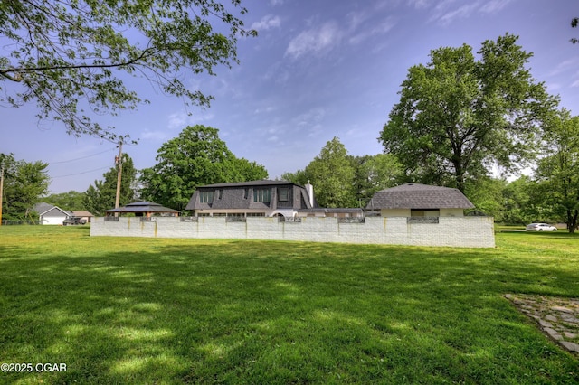 606 Meadowmere Dr, Webb City, MO 64870 - view of grassy yard with view of wooded area