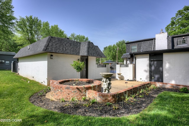 606 Meadowmere Dr, Webb City, MO 64870 - view of green lawn with an outdoor structure and a patio