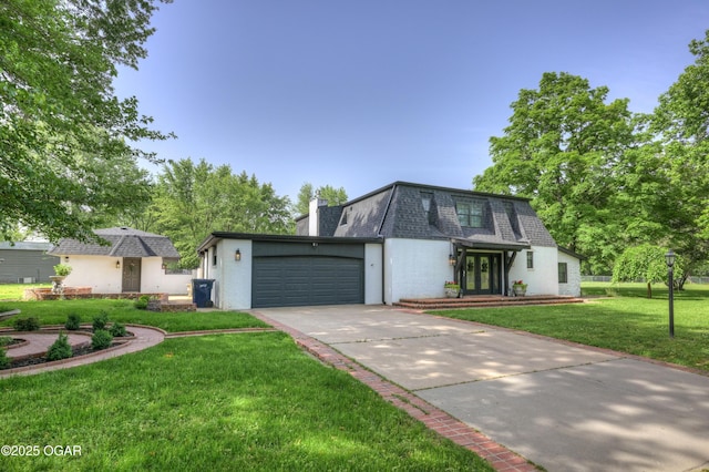 606 Meadowmere Dr, Webb City, MO 64870 - view of front of property featuring french doors, concrete driveway, a front lawn, an attached garage, and mansard roof