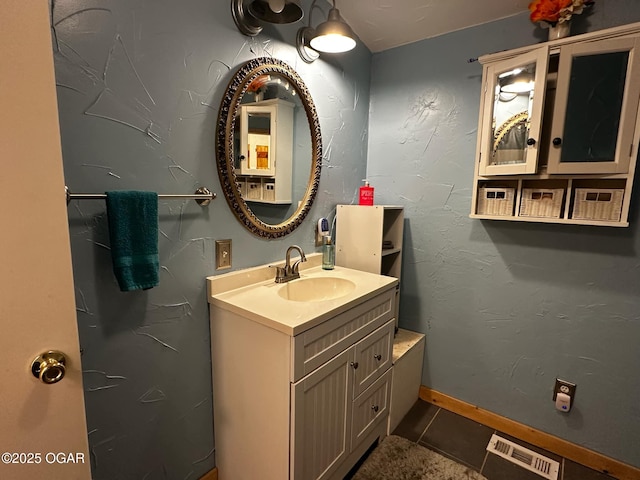 bathroom featuring tile patterned floors, vanity, and visible vents