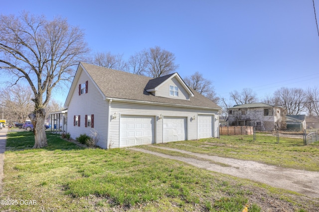 view of home's exterior featuring roof with shingles, a yard, fence, and dirt driveway