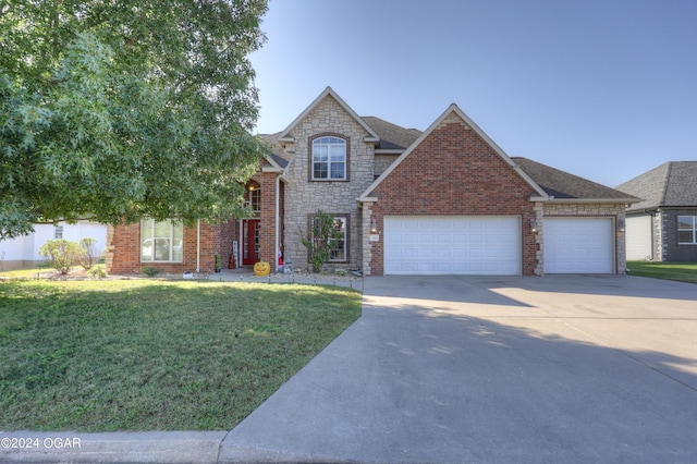 view of front of home with a front yard, a shingled roof, an attached garage, stone siding, and concrete driveway