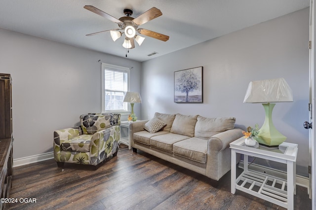living area with wood finished floors, ceiling fan, baseboards, and visible vents