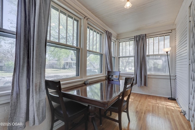 426 N Byers Ave, Joplin, MO 64801 - dining area with light wood finished floors and brick wall