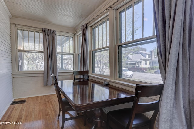426 N Byers Ave, Joplin, MO 64801 - dining area with visible vents, ornamental molding, and wood finished floors