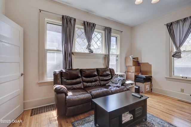426 N Byers Ave, Joplin, MO 64801 - living area featuring wood finished floors, baseboards, and visible vents
