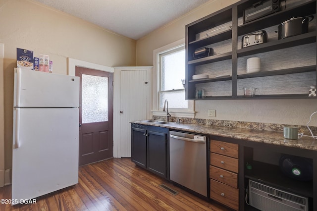 426 N Byers Ave, Joplin, MO 64801 - kitchen with freestanding refrigerator, stainless steel dishwasher, dark wood-type flooring, open shelves, and a sink