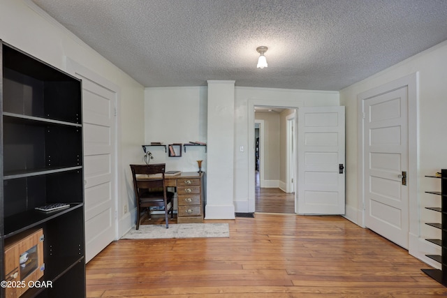 426 N Byers Ave, Joplin, MO 64801 - office featuring a textured ceiling, wood-type flooring, ornamental molding, and baseboards