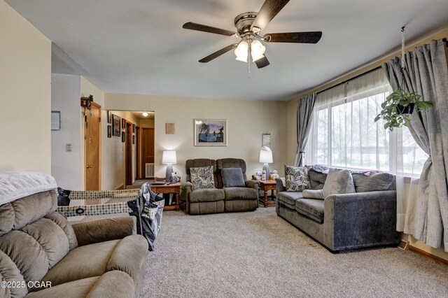 living room with carpet flooring and ceiling fan