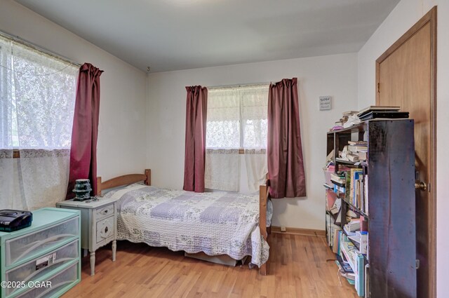 bedroom featuring light wood finished floors