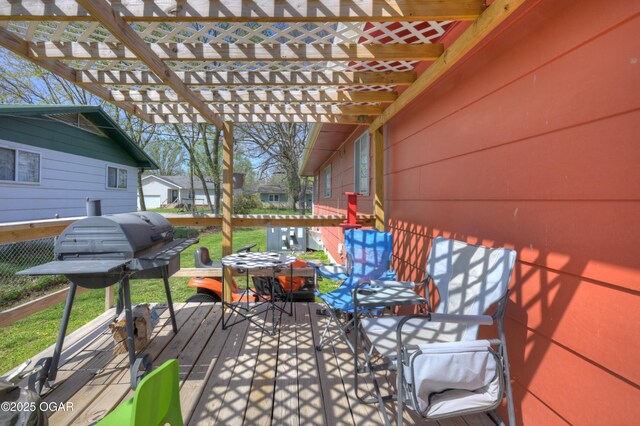 view of patio / terrace featuring a pergola, a deck, outdoor dining area, and area for grilling