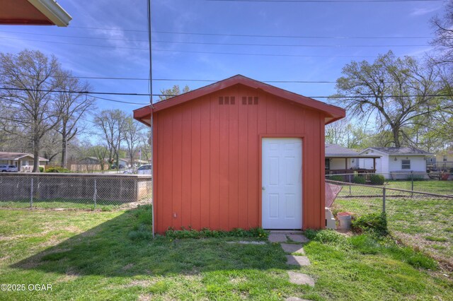 view of shed featuring a fenced backyard