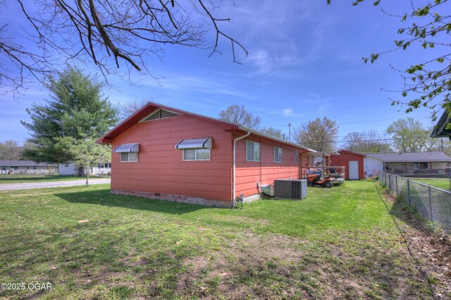 view of home's exterior featuring central AC, crawl space, fence, and a lawn
