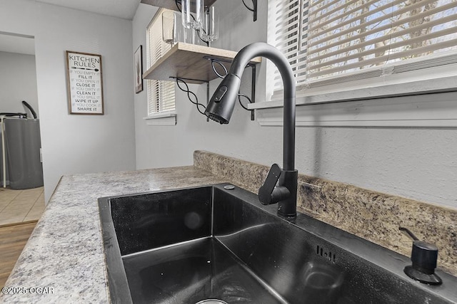 room details featuring wood finished floors and a sink
