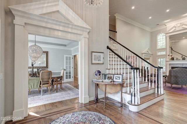 1000 Oakmont Dr, Joplin, MO 64804 - foyer featuring wood finished floors, ornamental molding, and stairway