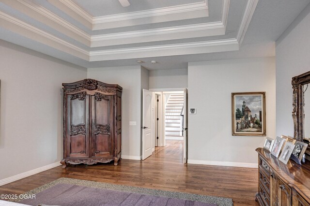 1000 Oakmont Dr, Joplin, MO 64804 - hall featuring a tray ceiling, crown molding, dark wood-style flooring, and baseboards