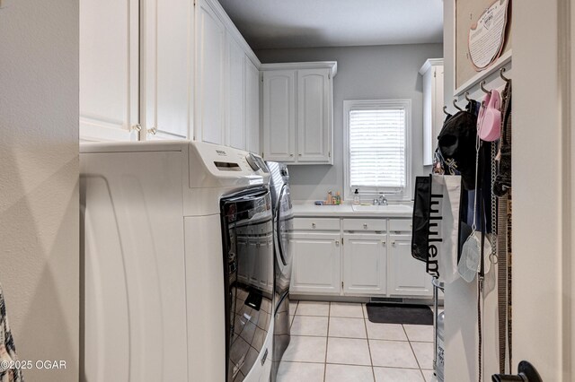 1000 Oakmont Dr, Joplin, MO 64804 - laundry room with light tile patterned floors, washer and clothes dryer, a sink, and cabinet space
