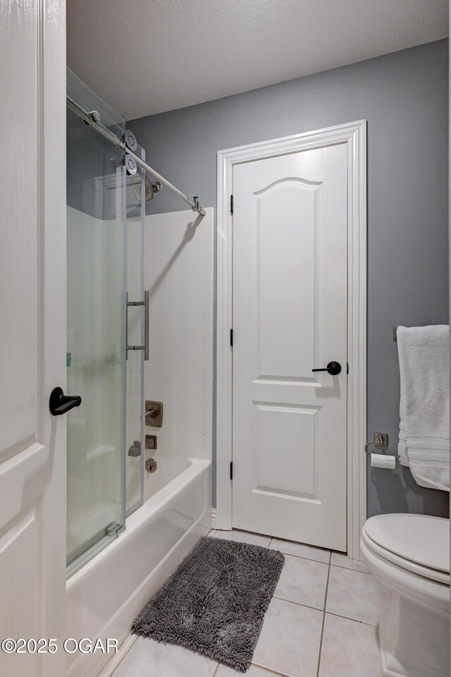 1000 Oakmont Dr, Joplin, MO 64804 - full bath with toilet, tile patterned floors, and shower / bathtub combination