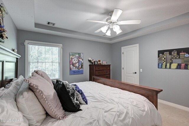 1000 Oakmont Dr, Joplin, MO 64804 - bedroom with visible vents, baseboards, a raised ceiling, a ceiling fan, and carpet floors