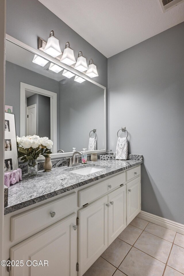 1000 Oakmont Dr, Joplin, MO 64804 - bathroom featuring vanity, baseboards, tile patterned flooring, and visible vents