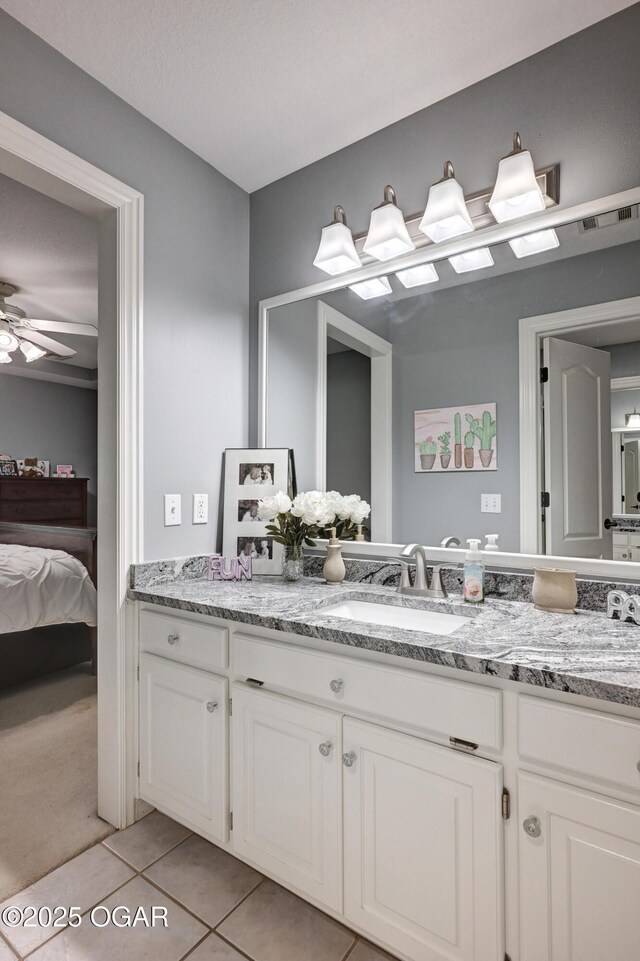 1000 Oakmont Dr, Joplin, MO 64804 - full bathroom featuring tile patterned floors, double vanity, a sink, and a ceiling fan