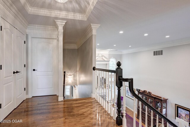 1000 Oakmont Dr, Joplin, MO 64804 - corridor featuring ornamental molding, visible vents, an upstairs landing, and wood finished floors
