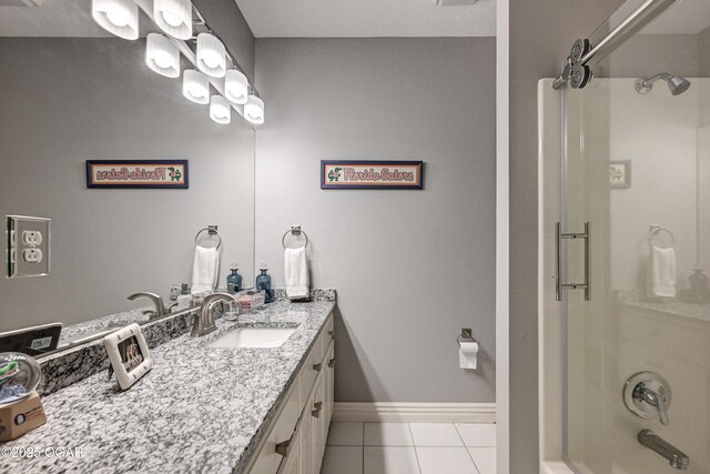 1000 Oakmont Dr, Joplin, MO 64804 - bathroom with tile patterned floors, vanity, baseboards, and  shower combination